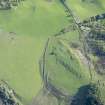 Oblique aerial view of the farmstead and rig at Clach Mhor, Straloch, in Strathardle, looking SSW.