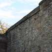 Upper section of west boundary wall, photograph from desk-based assessment and historic building survey of Fort House, Leith, Edinburgh