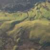 Oblique aerial view of a farmstead, field system and rig at Knock Barrie, looking SSW.