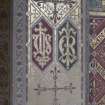 Painted decoration on chancel arch.