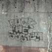 Graffiti on perimeter wall of sewage treatment works