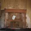 East wall of gardener's store showing red sandstone fireplace and decorated plaster ceiling, photograph from a historic building appraisal at Muirfield Gate, Duncur Road, Gullane