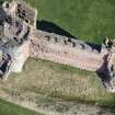 Oblique aerial view of the Mid Tower and East Tower at Tantallon Castle, looking NNE.