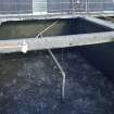Water filtration plant. View of tank no. 4 from south, Filtration process beginning. Central pipe forces air into the gravel and air is bubbled up through the water to agitate it.The tank contains filters consisting of 4 layers of gravel through which the water passes to remove all solid foreign bodies