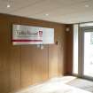 Interior. View of Administration office building, ground floor, reception area entrance with company sign