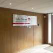 Interior. View of Administration office building, ground floor, reception area with company sign