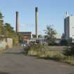 General view of site from west. Disused power house and chimney of left. Biomass Plant on right.