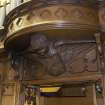 Chancel. Detail of carved angel above organ.