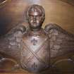 Chancel. Detail of carved angel above organ.