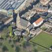 Oblique aerial view of St John's and King's Church, looking N.