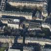 Oblique aerial view of the construction of student flats on the site of the former printing works and John Sinclair House, looking N.