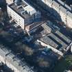 Oblique aerial view of the construction of student flats on the site of the former printing works and John Sinclair House, looking WNW.