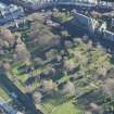 Oblique aerial view of St Michael's Parish Church and Beadle's House, looking SE.
