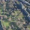 Oblique aerial view of St Michael's Parish Church and Beadle's House, looking E.