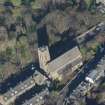 Oblique aerial view of St Michael's Parish Church and Beadle's House, looking N.
