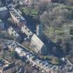Oblique aerial view of St Michael's Parish Church and Beadle's House, looking W.