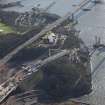 Oblique aerial view of the construction of Queensferry Crossing on the north bank, looking SE.