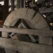 Basement. Under-stage area. Wooden drum wheel for stage trap