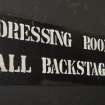 Backstage left, detail of sign ' Dressing Rooms All Backstage'