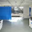 General view of sample four bed room with drawn partition curtain in Ward 3.