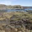 East side of island, view from high ground to west and across central spoil, walls and workings looking towards Ellanabeich