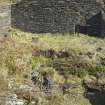 Building to north of boiler house, detail of plinth, riser pipe, bracket and sunken pit