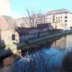 View from Walker Bridge, Yeaman Place, looking north over Union Canal to the brick wall of the former Public Wash House, MurdochTerrace, Edinburgh