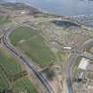 Oblique aerial view of the A90 road junction and road works for the Queensferry Crossing, looking NW.