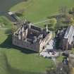 Oblique aerial view of Linlithgow Palace and St Michael's Church, looking ENE.