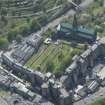 Oblique aerial view of Cathedral of St Mungo Burial Ground, Glasgow Cathedral and the Royal Infirmary, looking SE.