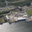 Oblique aerial view of Newark Castle, Ferguson Ailsa Shipyard and Newark Works, looking SW.