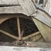 Detail of waterwheel. The over shot water wheel is of metal construction and is encased within a wooden jacket. This waterwheel powered an electricity generator in the adjacent building.