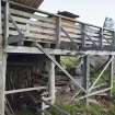 Decking and wood store at east end of sawmill, view from south