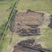 Oblique aerial view of the site under excavation.