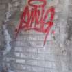 Graffiti art tag by Smug.