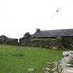 The unroofed range behind the cottage from the WNW