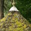 Detail of summerhouse roof showing thatch and capped finial, Braemar.