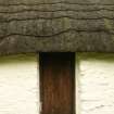  Detail of  thatched roof showing rope supports and overgrown ridge; cruck-framed cottage, Torthorwald.