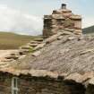 Detail of roof and chimney stack showing thatch and stone weights, bothy; Burnmouth House Hoy, Rackwick.