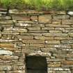 Detail of wall showing alcove and turf above the roof; Dounby Click Mill Orkney.