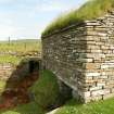 Detailed view of mill from side corner showing stone construction, mill lade and turf roof; Dounby, Orkney.