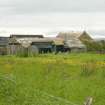 General view of mostly derelict mid 19th century farmstead including longhouse with flagstone and part thatched roof, bothy and barn; Yinstay, Scarpigar, Orkney.