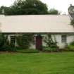 General view of probable 18th century cottage showing corrugated iron roof; Camserney.