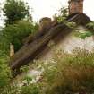 View of gable end with  vegetation growth; former schoolhouse, Cottown.