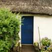 Detail of thatching over doorway; West End Cottages, Rait.
