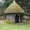 Side view of circular thatched Summerhouse; Traquair House.