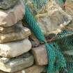 Detail of stones and netting; Norse Mill, Huxter.