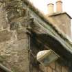 Detail of crowstepped skews and thatch over cement fillet;  Moncrief House, High Street, Falkland.