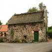 View of restored, thatched late 18th century two storey former village wash house; Braehead, Collessie.