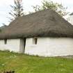 View of  19th century single storey heather thatched cottage;Tullochard, Plockton.